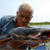 Jeremy Wade holds a blue catfish.