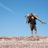 Les Stroud finds driftwood for a fire on Tiburon Island.