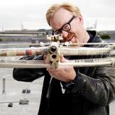 Adam Savage poses with the paper crossbow on Aug. 14, 2007.