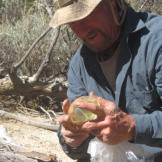 One useful technique for starting a fire -- if a plastic bag is available -- is to fill it with a fist size amount water and make it into a ball. If used properly, this water bag will work like a lens to focus sunlight that can light tinder. But in the Baja desert. with drinking water in very short supply, Dave improvises and uses his own urine as a substitute for water.