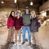 The flying Tweto family — Ayla, Ariel, Jim and Ferno — in one of the cargo hangars at the Unalakleet airport.