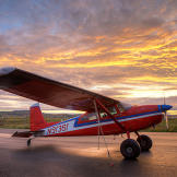 Jim's beloved 1969 Cessna 180 is the only plane he still likes to fly. The 180 is a great bush plane with "tail-dragging" performance that keeps the prop up during off-airport landings.