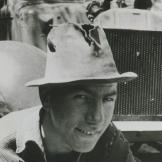 John in front of his 1934 Willy fixing the engine. By this time, John was a top-notch engine mechanic and all around handyman, skills that would serve him well through the years.