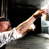 Jamie Hyneman tests golf-ball aerodynamics at NASA's wind chamber in 2009.