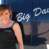 Kari Byron with "Big Dawg," a helicopter used in "Demolition Derby" and "Escape Slide Parachute."