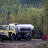 The fuel truck from Dawson stops by to fill up the claim's fuel storage drums. Expenses for diesel - to power both machines and the generator - typically run around $1,000 a day. Gold's not the only commodity that's gone up in price.