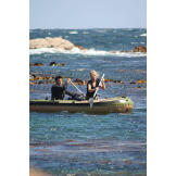The Hawkes paddle into the rough surf off the Tasmanian coast, just before their raft is "damaged" to simulate the type of traumatic event which often precedes survival situations. The premise for these survival missions is simple: most rescues happen within a few days, and what you do during these first hours often determines if you make it or not.
