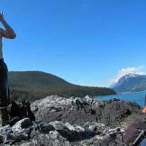 After a cleansing swim in one of the nearby lakes, one production crew member slathers on DEET, the only defense against the constant swarms of biting flies, mosquitoes and no-see-ums.