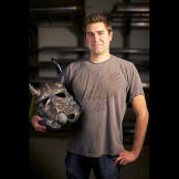 Tory Belleci poses with the customized Stormtrooper helmet he created for the 501ST TK PROJECT. Tory's Viking Helmet is one of more than 50 unique and artistically-modified Stormtrooper helmets that was displayed and auctioned off during