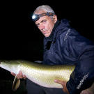 Jeremy Wade holding a river monster.