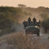 Biggs (Navy SEAL fmr.), Oz (Green Beret), Saw (Navy SEAL fmr.), Rob (Navy SEAL ret.) traveling on Reva vehicle on patrol.