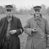 Two old members of the Volksturm, the national militia, seem relieved to have surrendered to British troops in Bocholt, North Rhine-Westphalia, Germany March 1945.