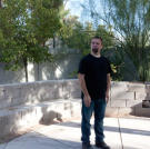 Pondering the meaning of life....or just calculating profit? Steve Simons looks over the backyard of a newly acquired property.