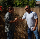 Buyers Doug Hopkins and Ed Rosenberg shake hands in a rare moment of friendliness.