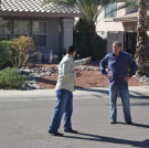John Ray points an accusing finger toward fellow buyer Doug Hopkins.
