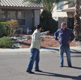 John Ray points an accusing finger toward fellow buyer Doug Hopkins.
