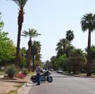 Ed Rosenberg stands with his motorcycle.