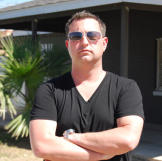 Scott Menaged is an in-your-face New Yorker who has made a place for himself in the Phoenix market—and shown that he knows how to bring in the big bucks.