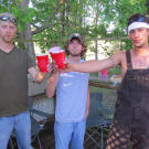 Chris "Flip" Woodall, Lathan Shivers and Dustin "Duck" Campbell cheers to their new home in the bayou.