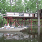 Many homes in the bayou are raised up on stilts, or pilings. The elevated height keeps them from flooding during storms.