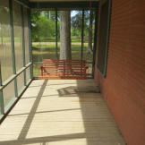A screened-in patio is a must for enjoying those warm nights in the bayou...and to keep those pesky mosquitoes away.