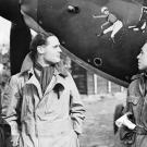 Squadron Leader Douglas Bader and mates admiring the nose art on a Hawker Hurricane of Der Fuhrer getting a butt whuppin'.
