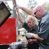 Chuck and Sandy Baker check their pit.
