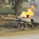 Still in flames, a destroyed Chinese-made Type 69 Main Battle Tank (MBT) north of the An Nu'maniyah bridge on Highway 27, during Operation Iraqi Freedom, April 2003.
Watch video of the