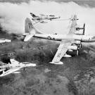 Witness the first triple-point refueling operation with three F-100c Super Sabres attached to a Boeing KB-50D Superfortress in 1956.